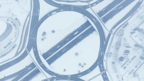 Highway junction intersection roundabout traffic in winter, aerial top down Video stock 102457843