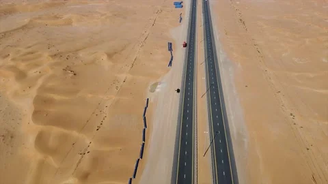 A highway in the middle of the Arabian desert Stock Footage 136772871