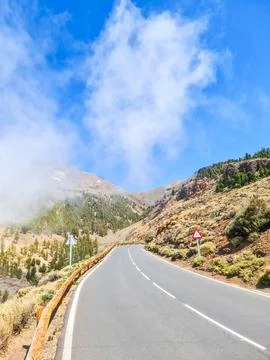A highway with a mountain in the background Stock Photos