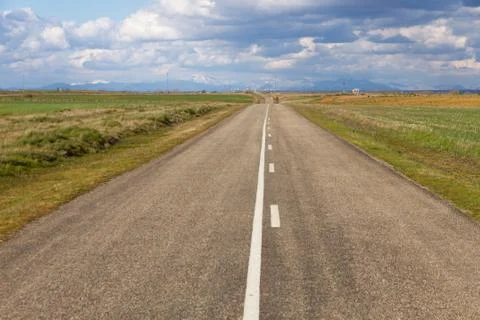 Highway with mountains in the background 스톡 사진