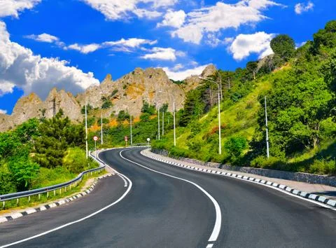 Highway in the mountains Stock Photos