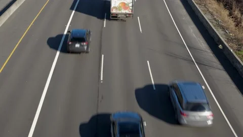 Highway ongoing traffic, top angle view. Видео 147963175