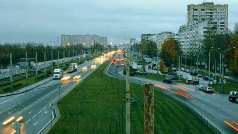 Highway In The Outskirts Where Old Panel Houses Stands Against New Buildings Stock Footage 98136994