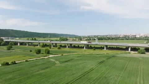 Highway overpass over fields aerial drone footage in summer Stock Footage 243838325