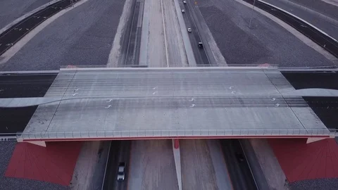 Highway overpass with traffic driving under bridge Stock Footage 81574965