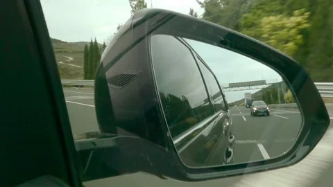 Highway overtaking through the side mirror Stock Footage 152827117
