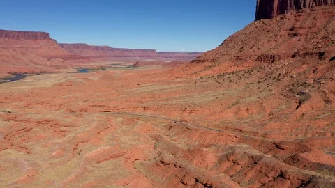 Highway Passes Through Canyon With Red Sandstone Cliffs And Dunes Aerial View Stock Footage 120686207