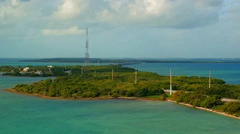 Highway passing through an island early in the morning with traffic moving both Stock Footage 61305553