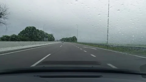 Highway on a rainy day through the windshield of a car. Stock Footage 155105158
