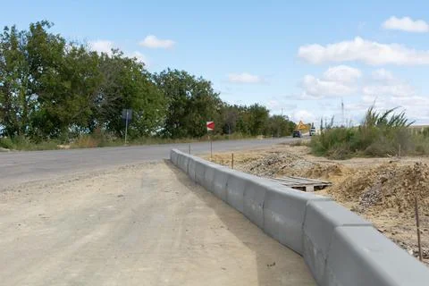 Highway road curb. Blocks in the base of the road, building a ring highway Stock Photos
