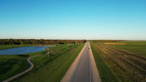 Highway road with a fields and pickup truck 動画素材 319427100