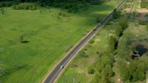 Highway road surrounded by green trees and grass in summer time, Russia 動画素材 132943591