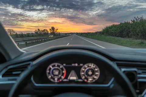 Highway road through windshield. Driving travel and route content. Stock Photos