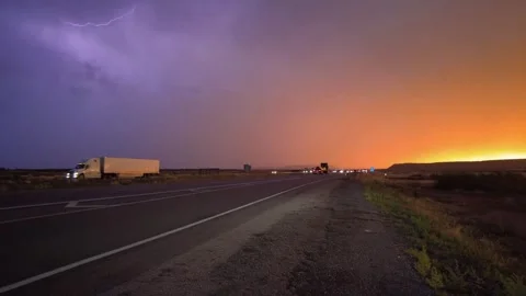 Highway road with traffic on it. sunset and rain, thunder and lightning Stock Footage 248122233