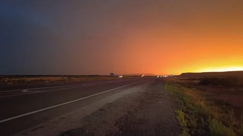 Highway road with traffic on it. sunset and rain, thunder and lightning Stock Footage 248122499