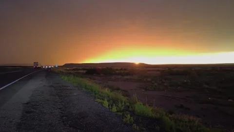 Highway road with traffic on it. sunset and rain, thunder and lightning Stock Footage 248122546