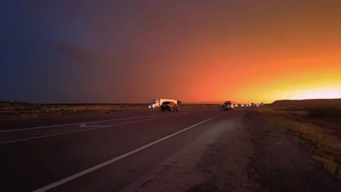 Highway road with traffic on it. sunset and rain, thunder and lightning Stock Footage 248122547