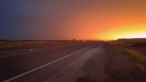 Highway road with traffic on it. sunset and rain, thunder and lightning Stock Footage 248122548