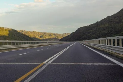 A highway running through the mountains. 스톡 사진