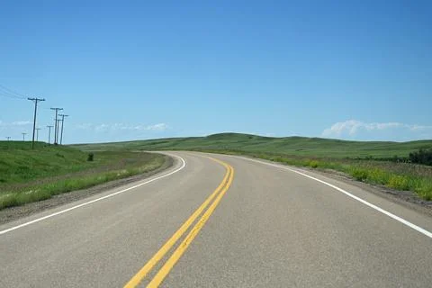 Highway in Saskatchewan, Canada. A road through a field in Saskatchewan 写真素材