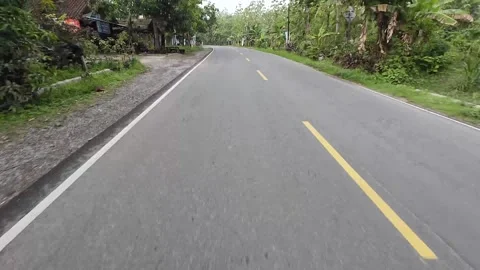 Highway scenery through deep forest in the district of Ngawi, East Java Video stock 317996315