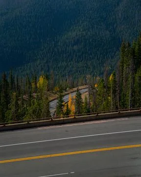 Highway through the mountains during fall with many curves Photos