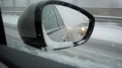 Highway through rearview mirror Stock Footage 72715615