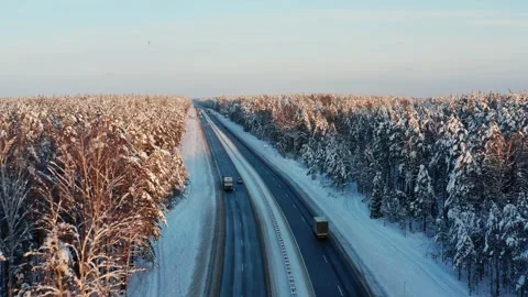 Highway through a snow-covered forest. Stock Footage 321464595