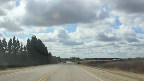 Highway through the windshield with beautiful clouds in the background Stock-Footage 146666472
