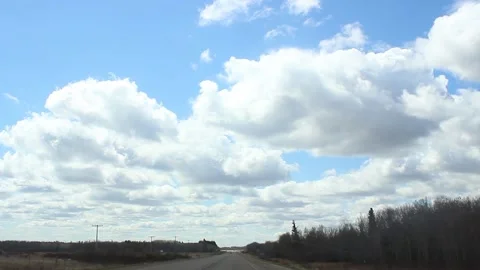 Highway through the windshield with beautiful clouds in the background III Stock Footage 146666620
