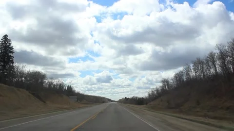 Highway through the windshield with beautiful clouds in the background IV Stock-Footage 146666785