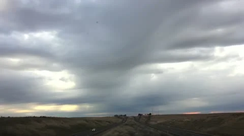 Highway timelapse with sun rays in dark clouds Stock Footage 12307107