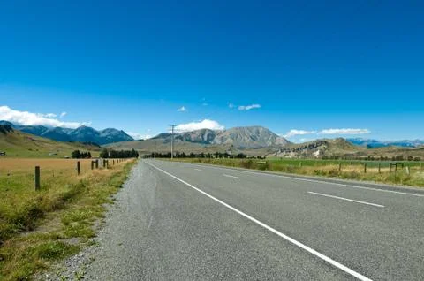 Highway towards panoramic mountain 스톡 사진