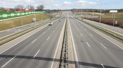 Highway traffic and dynamic clouds time lapse Stock Footage 48665872