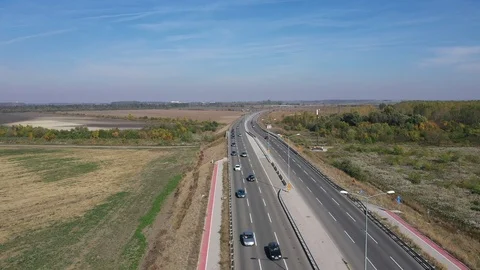 Highway traffic column of vehicles pull back Stock Footage 119567168