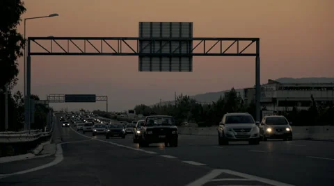 Highway traffic at dusk/sunset as vacationers return from summer holidays Stock Footage 54100828