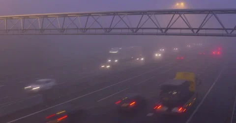 Highway traffic in mist - interchange A12, The Netherlands Stock Footage 71222401