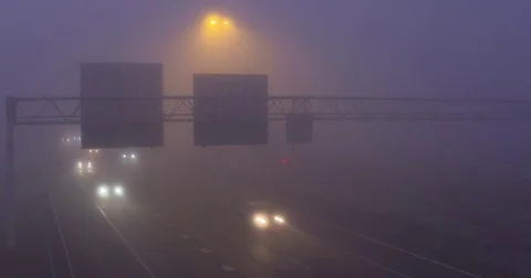 Highway traffic in mist - interchange A12, The Netherlands Stock Footage 71224596
