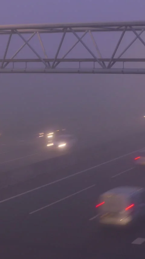 Highway traffic in mist - interchange A12, The Netherlands Stock Footage 311575422
