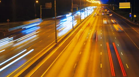 Highway traffic at night with car lights tails Stock Footage 63538752