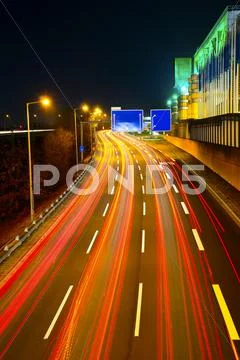 Highway traffic at night Stock Photos