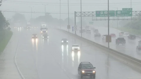 Highway Traffic in Rain 01 Stock Footage 98657379