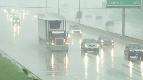 Highway Traffic in Rain 05 Stock Footage 98657392