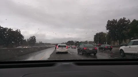 Highway traffic in rain Stock Footage 68994920