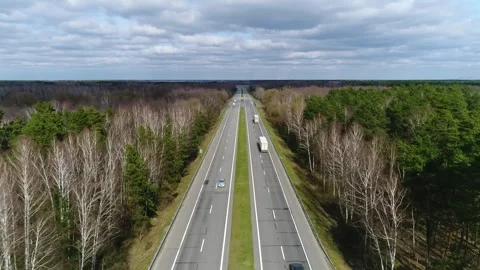 Highway with two lanes in two directions in spring Stock Footage 265756954