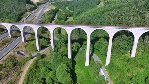 Highway under the old stone bridge Stock Footage 320930149