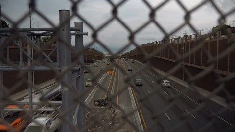 Highway, View Through Chain Link Fence, Daytime 库存影片 103590977