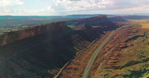 Highways and tracks going under the stunning mountains of Utah, USA.  Stock Footage 213349485