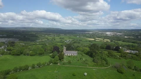 Highweek, South Devon, England: DRONE AERIAL VIEWS: All Saints Church &amp; Dartmoor Stock Footage 241336671