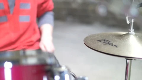 Hihat Close up of man playing the drumset in red outfit Stock Footage 104471361